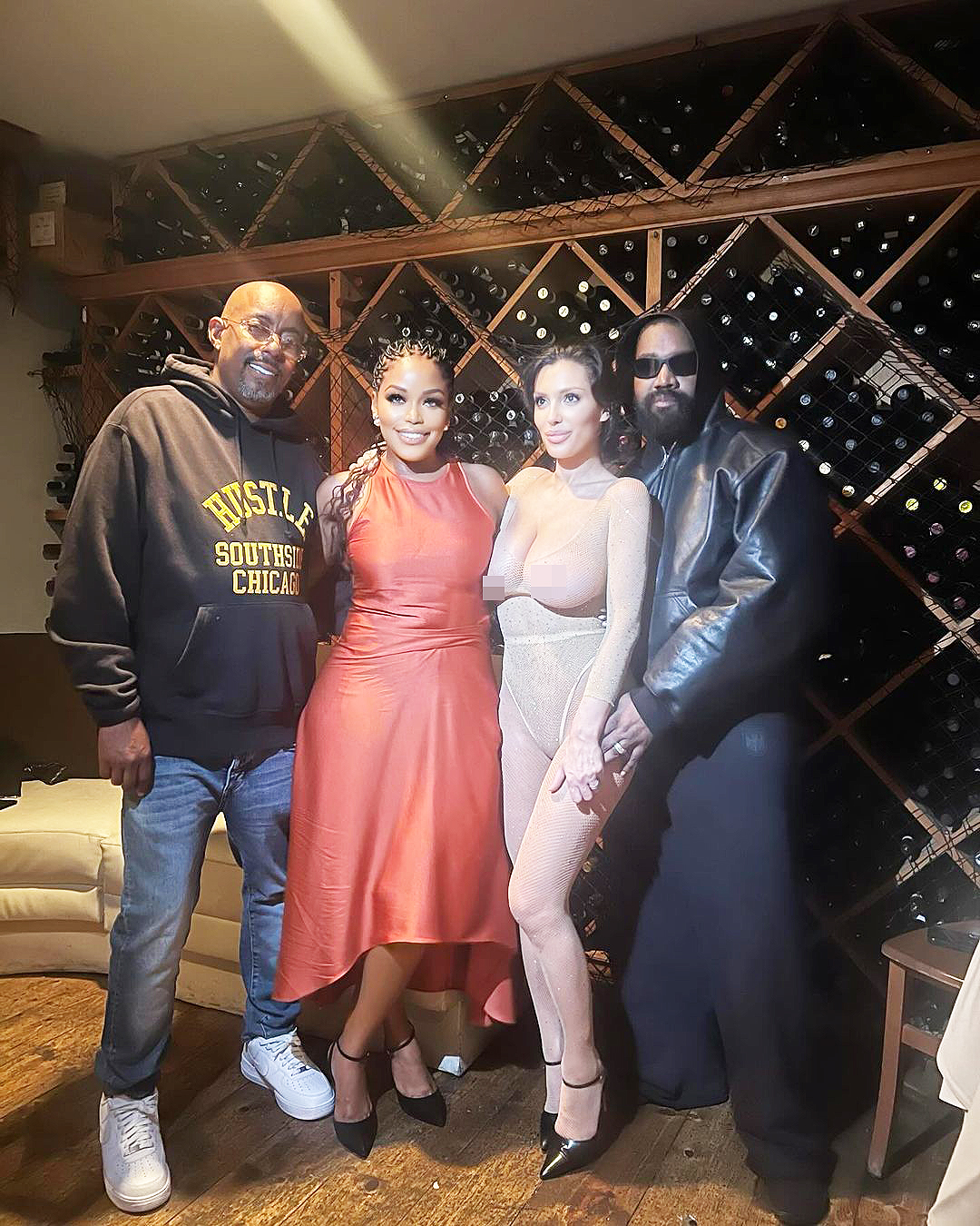 Bianca Censori with Kanye West and his manager John Monopoly.